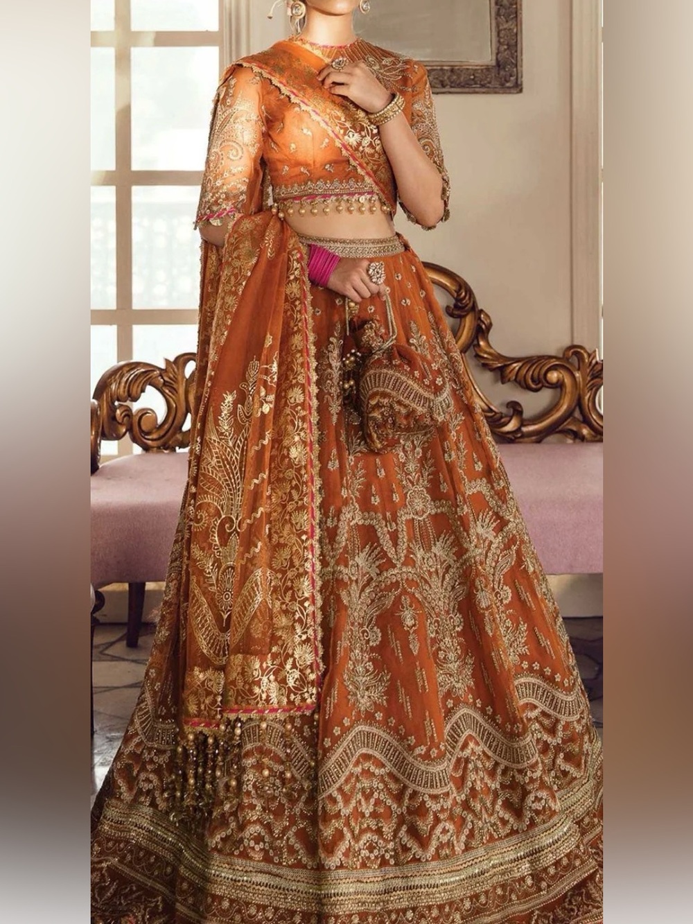Embroidered Orange Lehenga Set with Gold Accents bust 39